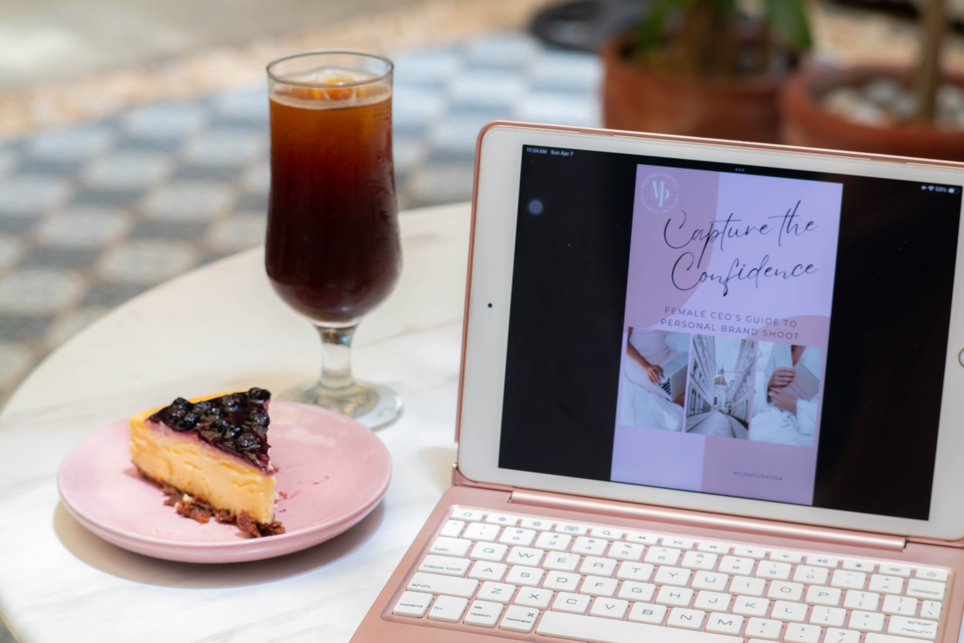 Capture the Confidence guide on a tablet with cheesecake