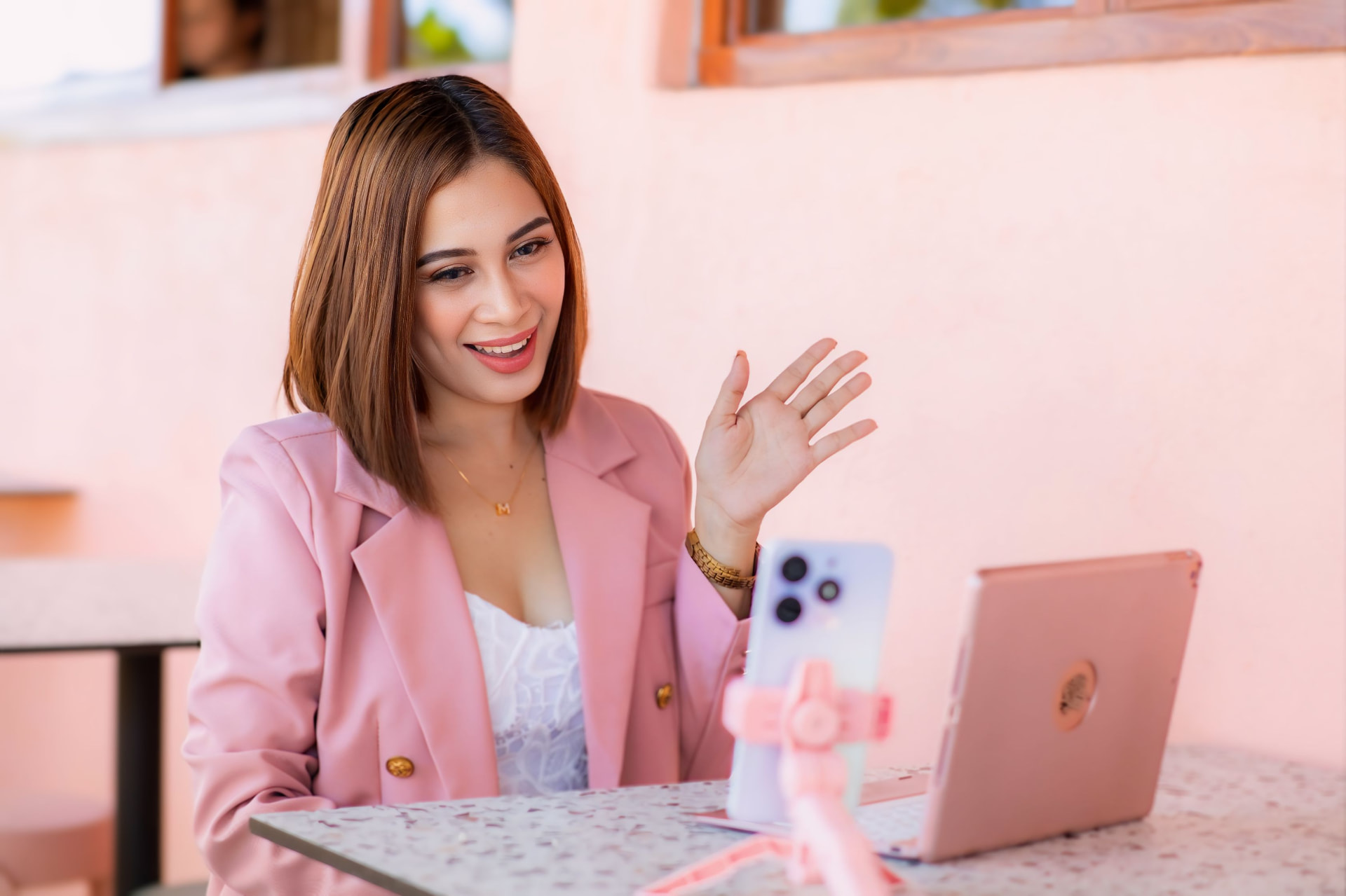 Myles waving on a client video call